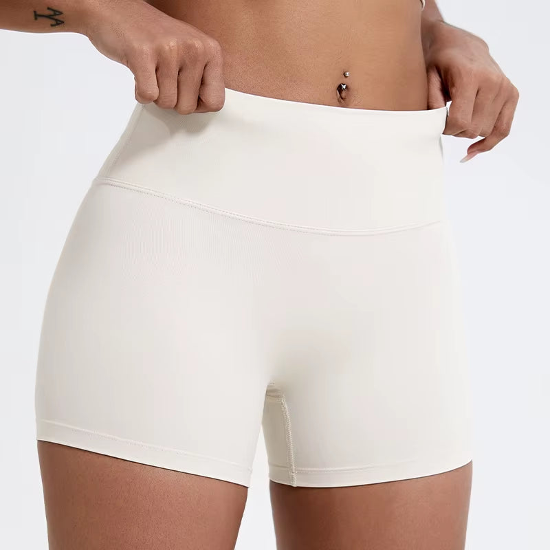 High-waisted sports shorts for women, designed to lift and shape, perfect for gym workouts, running, and fitness training. Made from soft, quick-drying fabric, these yoga shorts are ideal for comfortable and effective exercise.