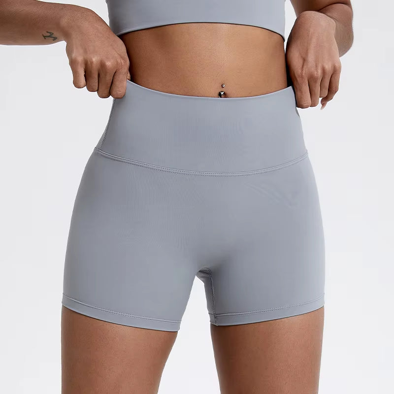 High-waisted sports shorts for women, designed to lift and shape, perfect for gym workouts, running, and fitness training. Made from soft, quick-drying fabric, these yoga shorts are ideal for comfortable and effective exercise.