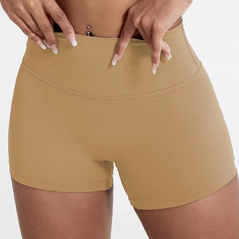 High-waisted sports shorts for women, designed to lift and shape, perfect for gym workouts, running, and fitness training. Made from soft, quick-drying fabric, these yoga shorts are ideal for comfortable and effective exercise.