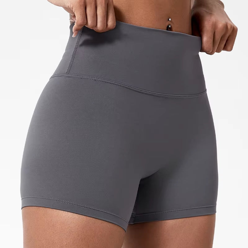 High-waisted sports shorts for women, designed to lift and shape, perfect for gym workouts, running, and fitness training. Made from soft, quick-drying fabric, these yoga shorts are ideal for comfortable and effective exercise.