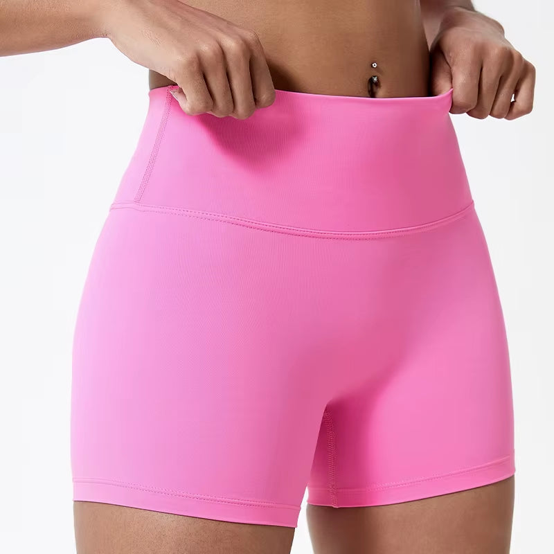 High-waisted sports shorts for women, designed to lift and shape, perfect for gym workouts, running, and fitness training. Made from soft, quick-drying fabric, these yoga shorts are ideal for comfortable and effective exercise.