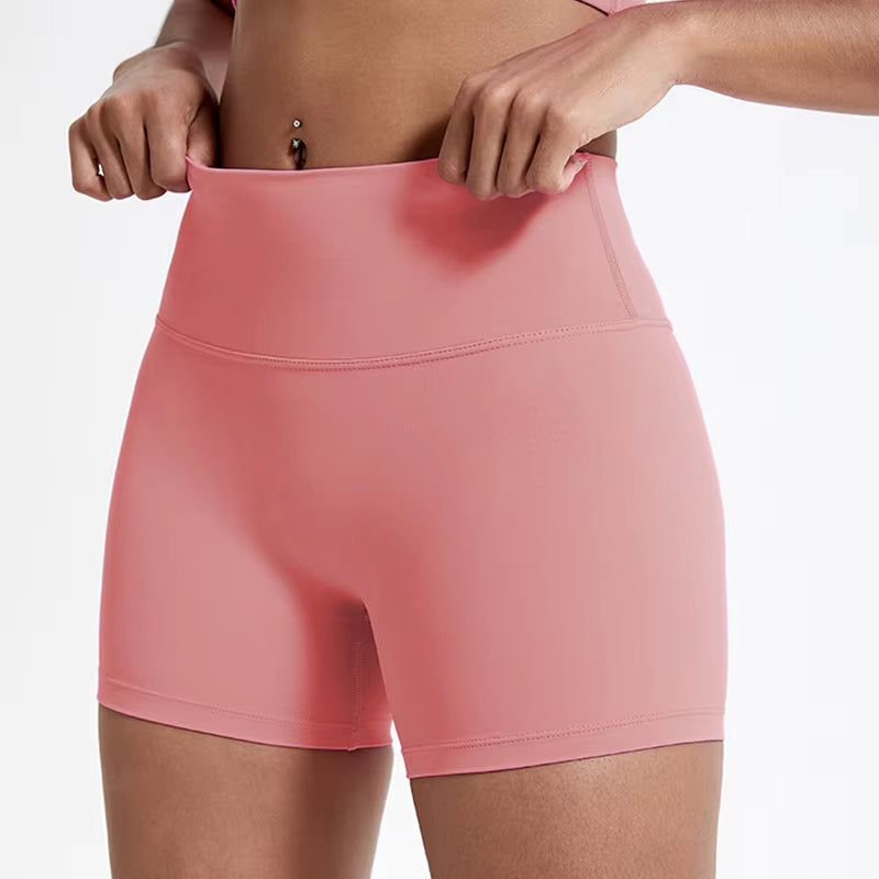 High-waisted sports shorts for women, designed to lift and shape, perfect for gym workouts, running, and fitness training. Made from soft, quick-drying fabric, these yoga shorts are ideal for comfortable and effective exercise.