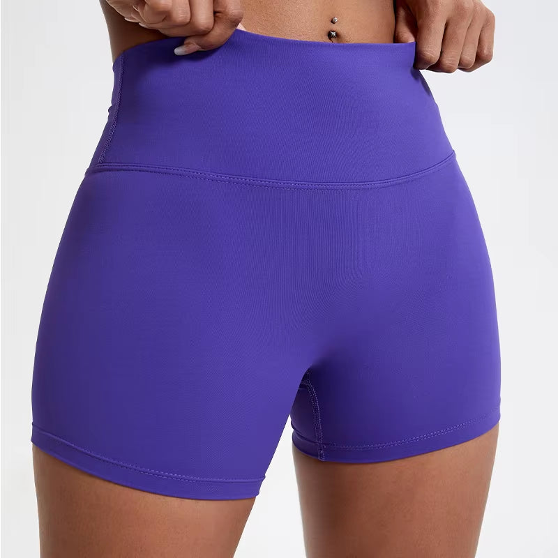 High-waisted sports shorts for women, designed to lift and shape, perfect for gym workouts, running, and fitness training. Made from soft, quick-drying fabric, these yoga shorts are ideal for comfortable and effective exercise.