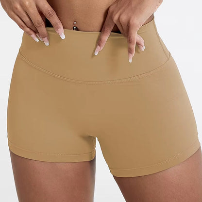 High-waisted sports shorts for women, designed to lift and shape, perfect for gym workouts, running, and fitness training. Made from soft, quick-drying fabric, these yoga shorts are ideal for comfortable and effective exercise.