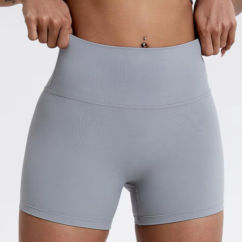 High-waisted sports shorts for women, designed to lift and shape, perfect for gym workouts, running, and fitness training. Made from soft, quick-drying fabric, these yoga shorts are ideal for comfortable and effective exercise.