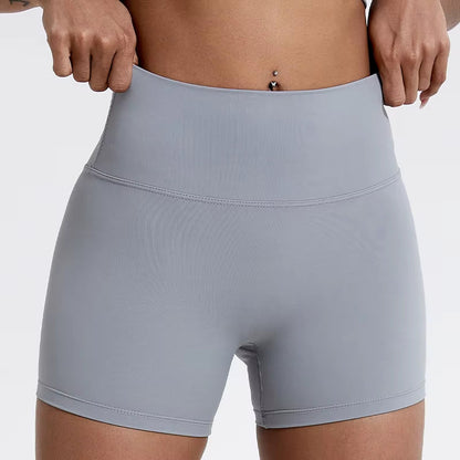 High-waisted sports shorts for women, designed to lift and shape, perfect for gym workouts, running, and fitness training. Made from soft, quick-drying fabric, these yoga shorts are ideal for comfortable and effective exercise.